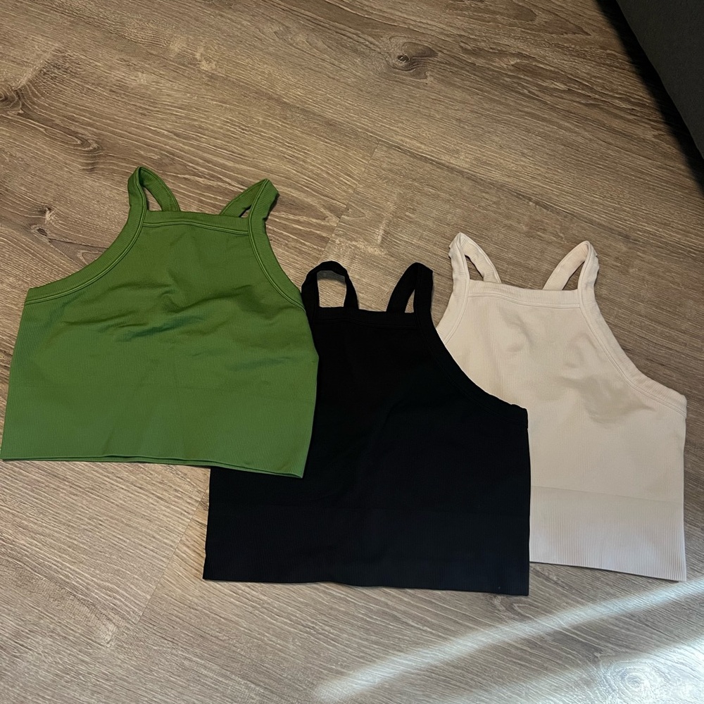 Athleta Green, black and white sports bras